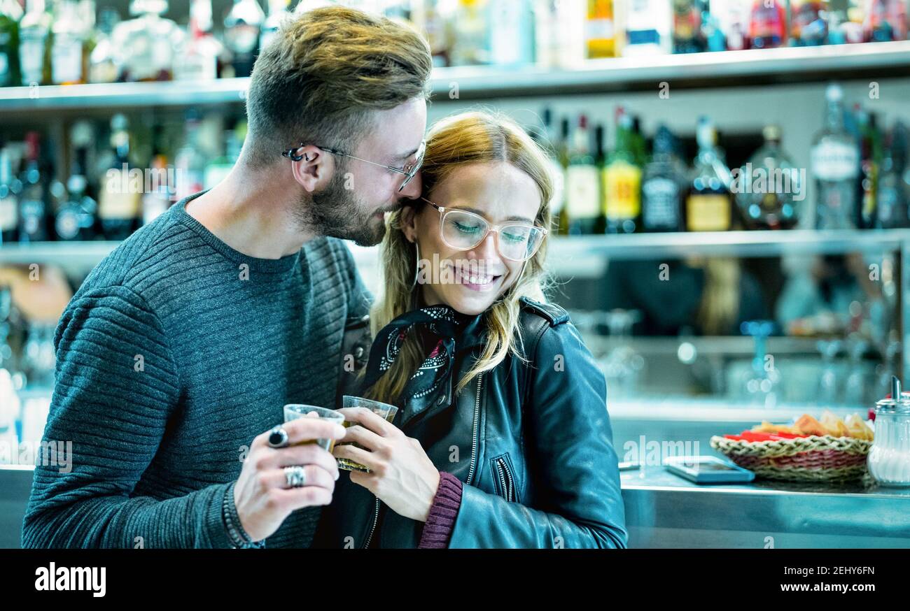 Young couple at beginning of love story in cocktail bar - Handsome man drinking coffee with nice woman - Relationship concept Stock Photo