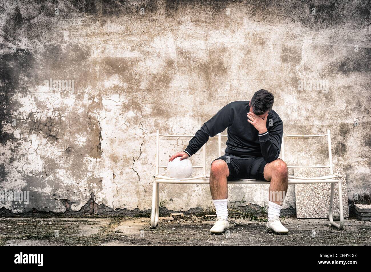 Soccer football goalkeeper feeling desperate after sport failure - Concept of guilt related to negative doping experience Stock Photo