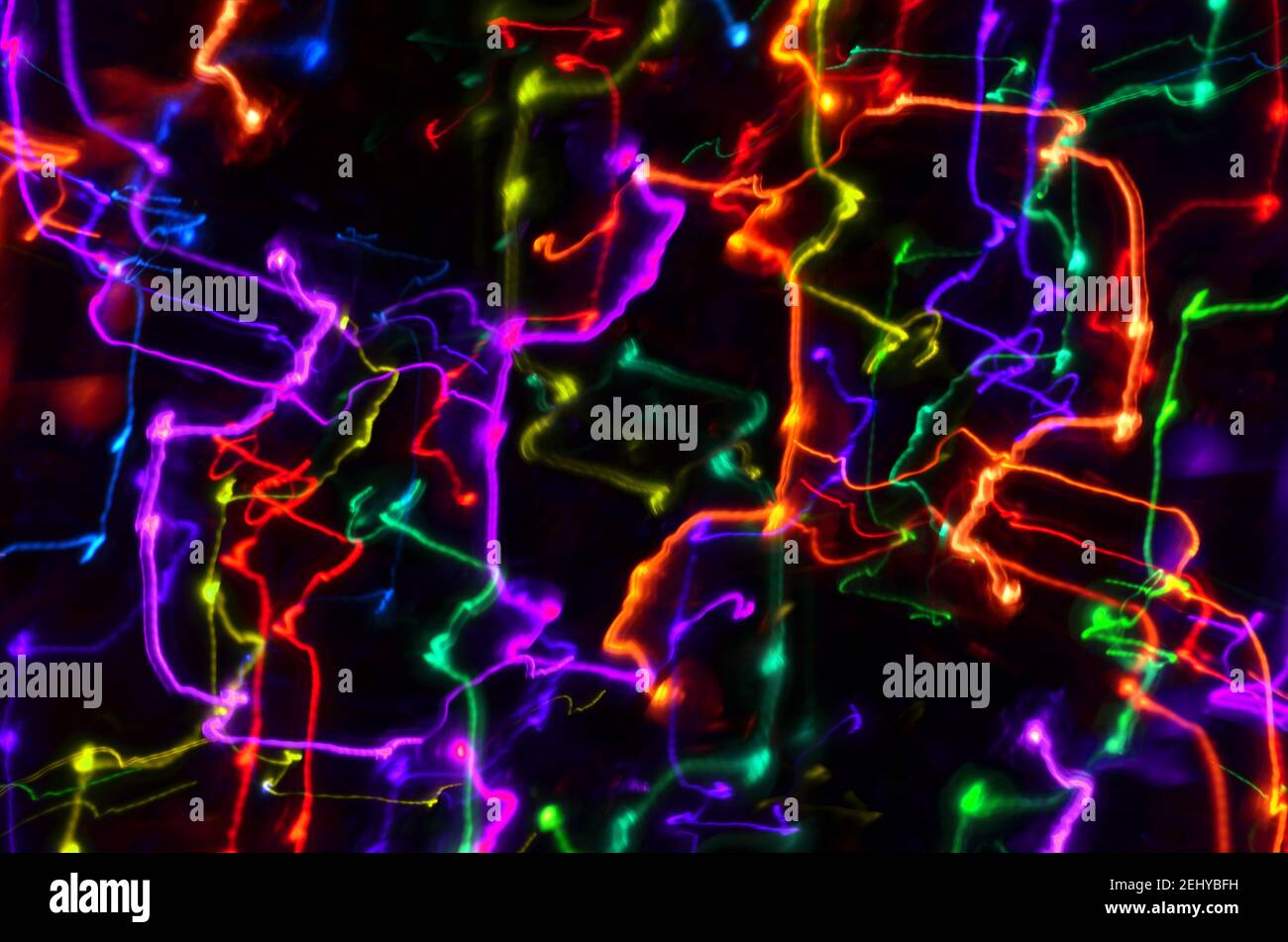 Multi-colored explosion of lights on dark background Stock Photo