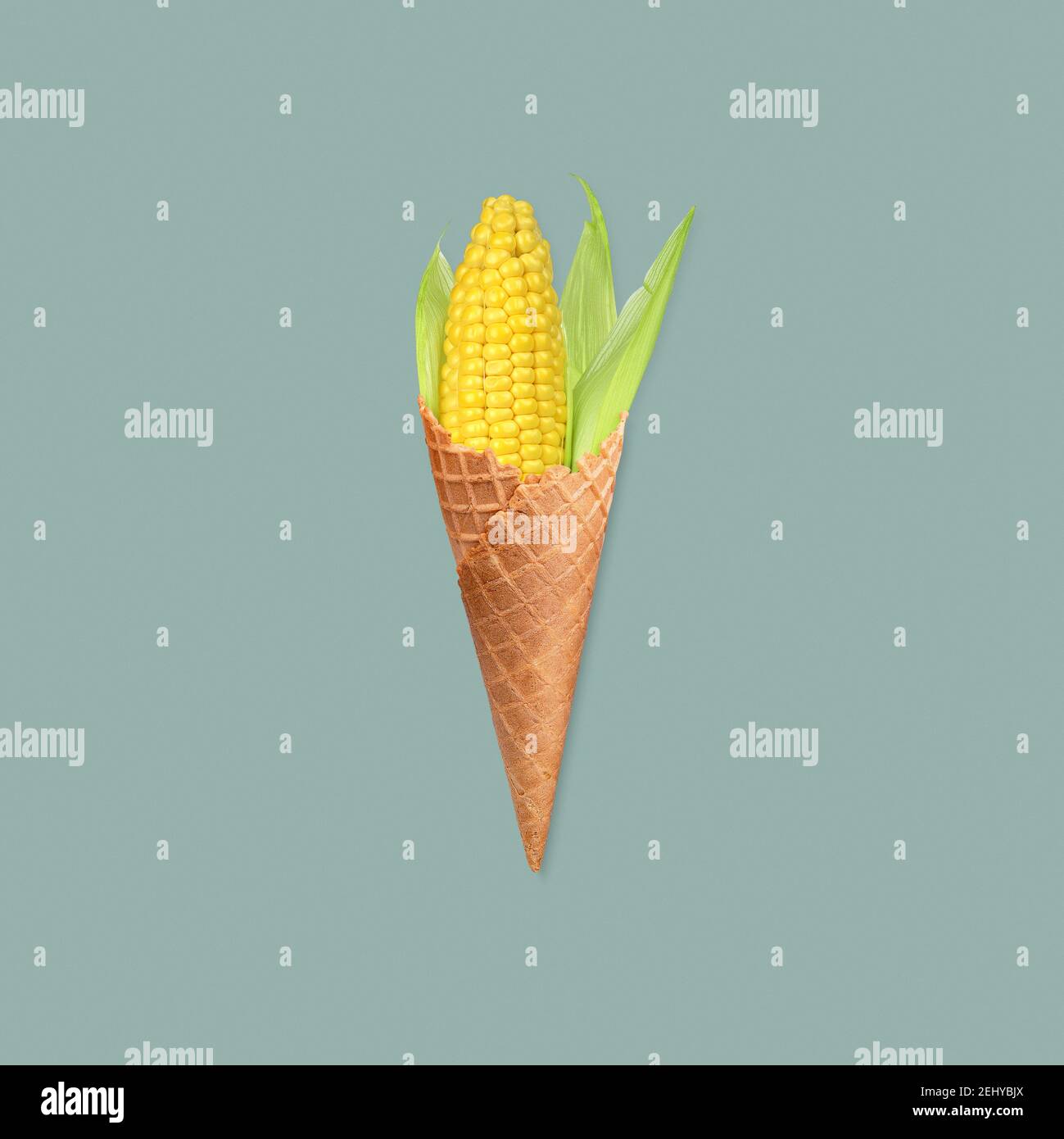 Funny healthy eating concept with corn ice cream photo manipulation on pastel background Stock Photo