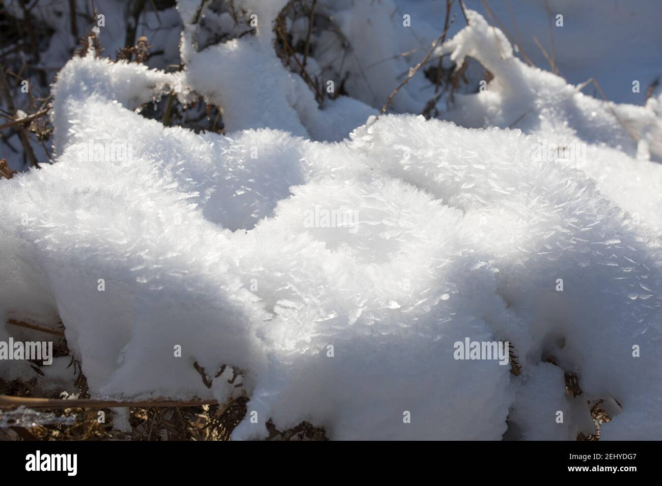 Snow chrystals formed by drifting snow Stock Photo
