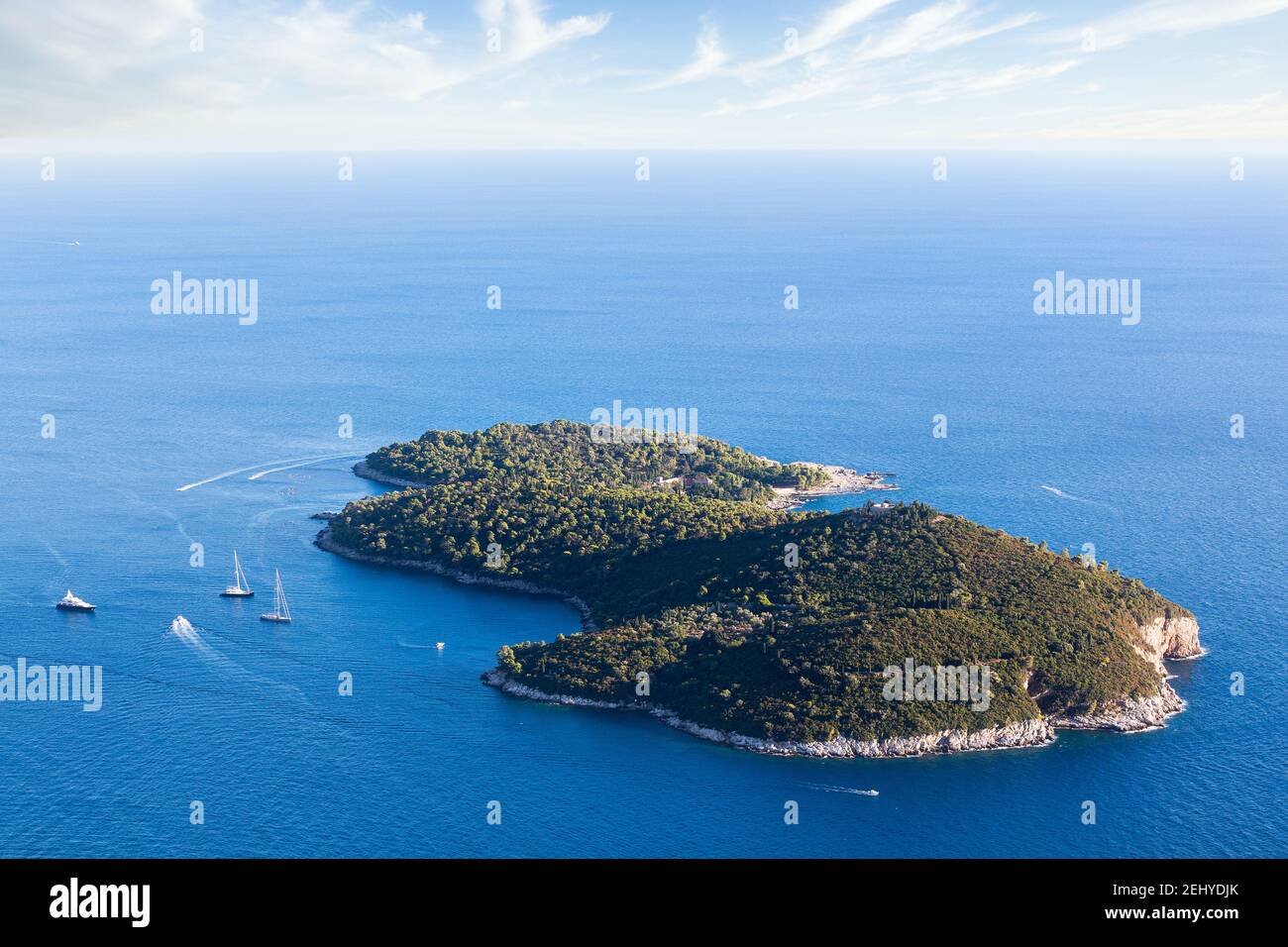 A Beautiful Green Island Lokrum Near Dubrovnik Surrounded by a Big Blue Sea, Sailboats, Boats and a Yacht Stock Photo