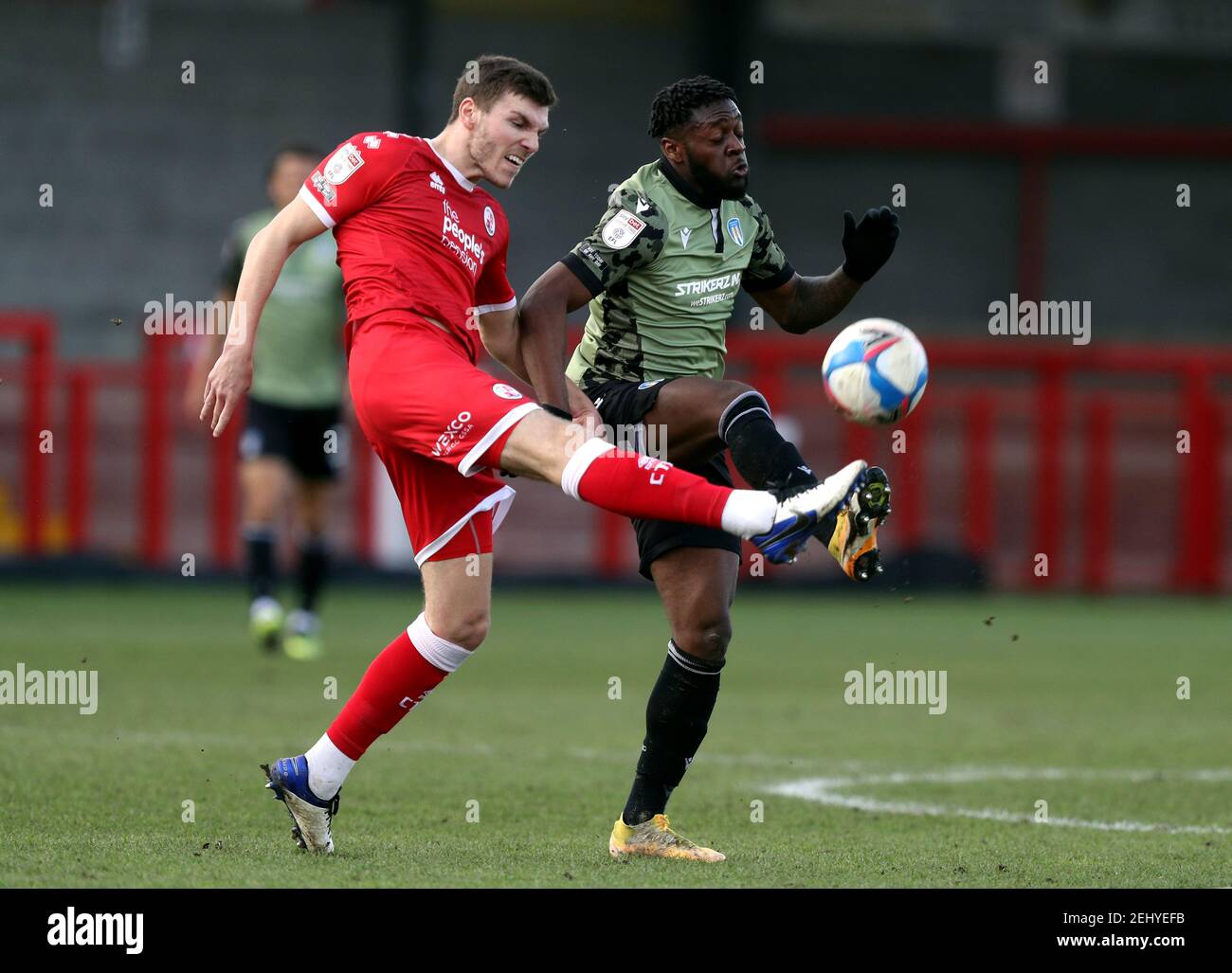 Crawley Town's Jordan Tunnicliffe (left) and Colchester's Aramide Oteh battle for the ball during the Sky Bet League Two match at The People's Pension Stadium, Crawley. Picture date: Saturday February 20, 2021. Stock Photo