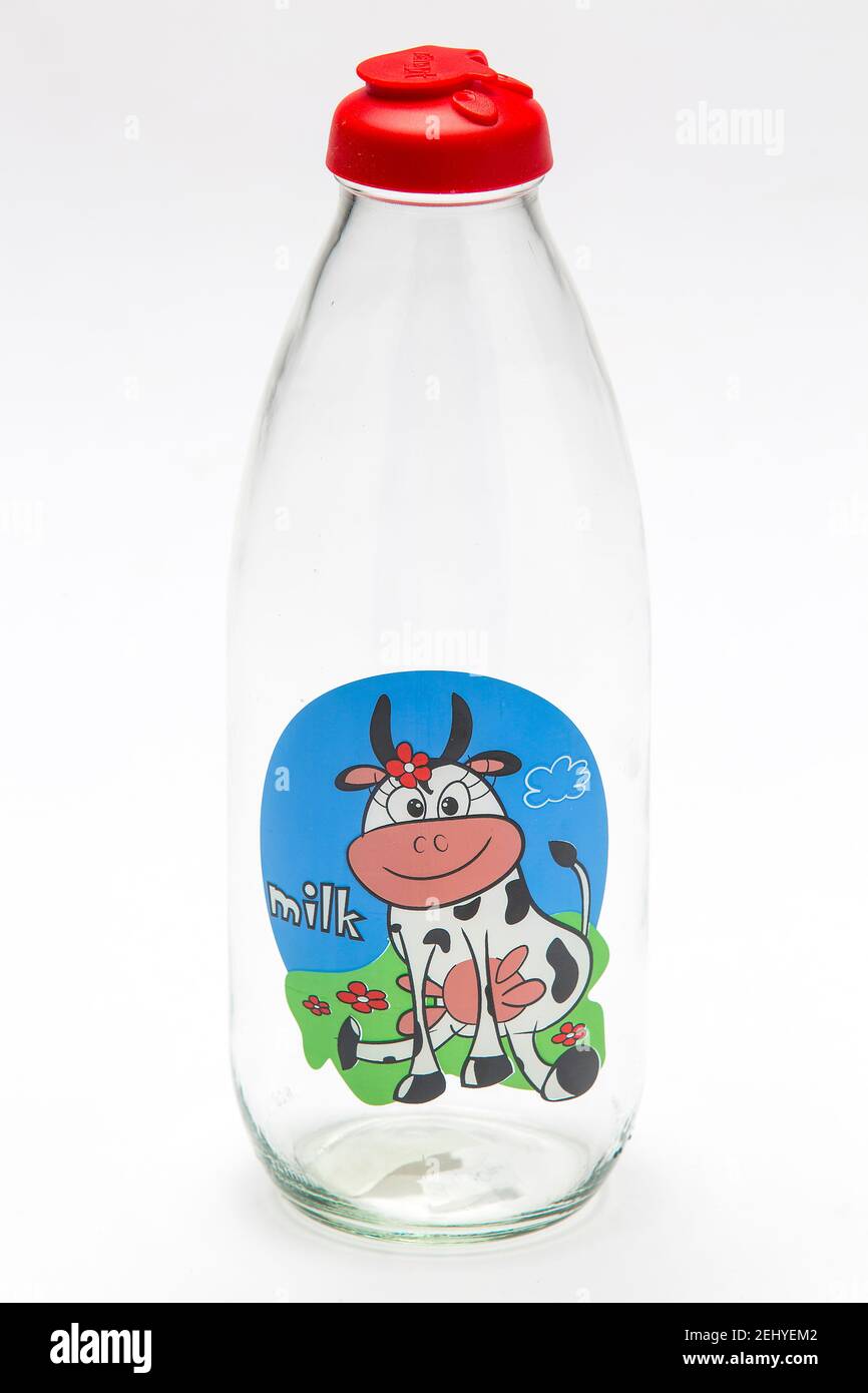 https://c8.alamy.com/comp/2EHYEM2/a-retro-empty-glass-bottle-of-milk-with-a-cow-drawing-on-it-and-a-red-plastic-cap-2EHYEM2.jpg