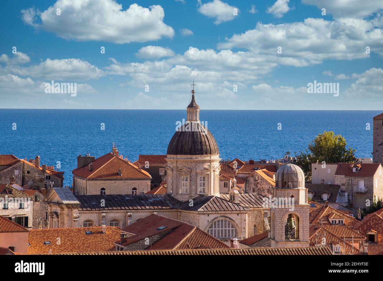 A Tower Overlooking the City of Dubrovnik,  Blue Sea with blue skies and white clouds Stock Photo