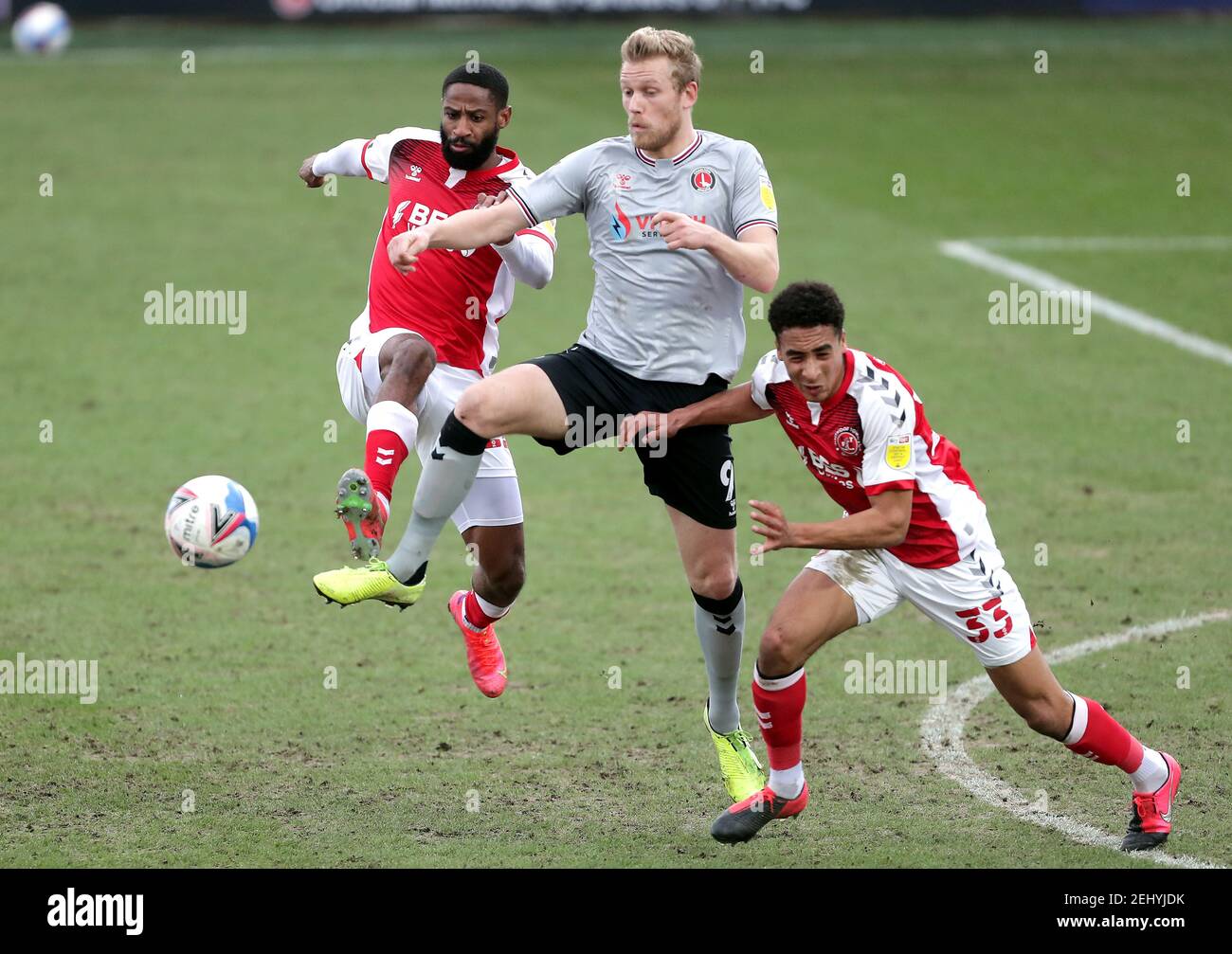 Charlton Athletic's Jayden Stockley (centre) battles for the ball with Fleetwood Town's Janoi Donacien (left) and James Hill during the Sky Bet League One match at Highbury Stadium, Fleetwood. Picture date: Saturday February 20, 2021. Stock Photo