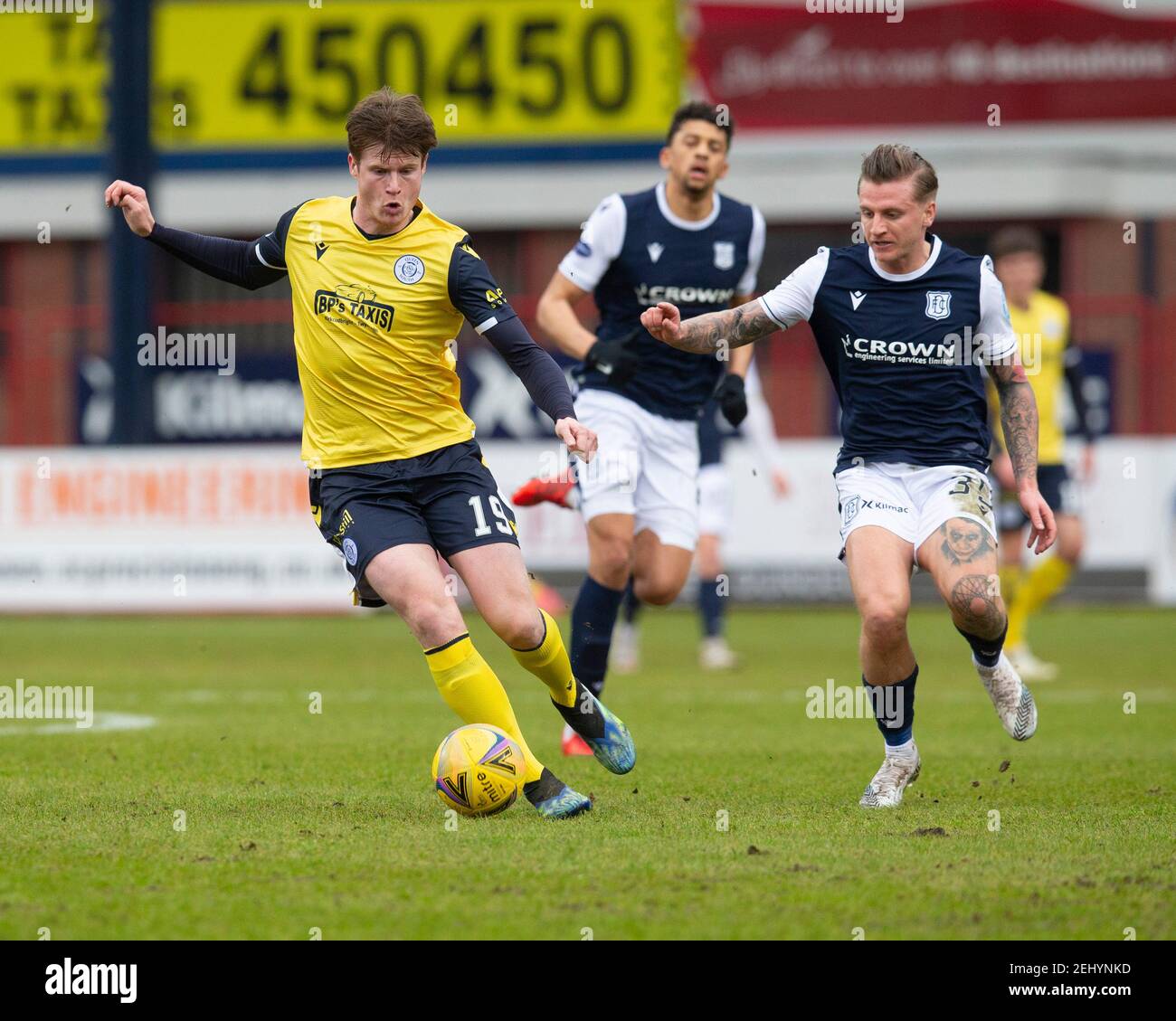 Dens Park, Dundee, UK. 20th Feb, 2021. Scottish Championship Football, Dundee FC versus Queen of the South; Calvin McGrory of Queen of the South and Jason Cummings of Dundee Credit: Action Plus Sports/Alamy Live News Stock Photo