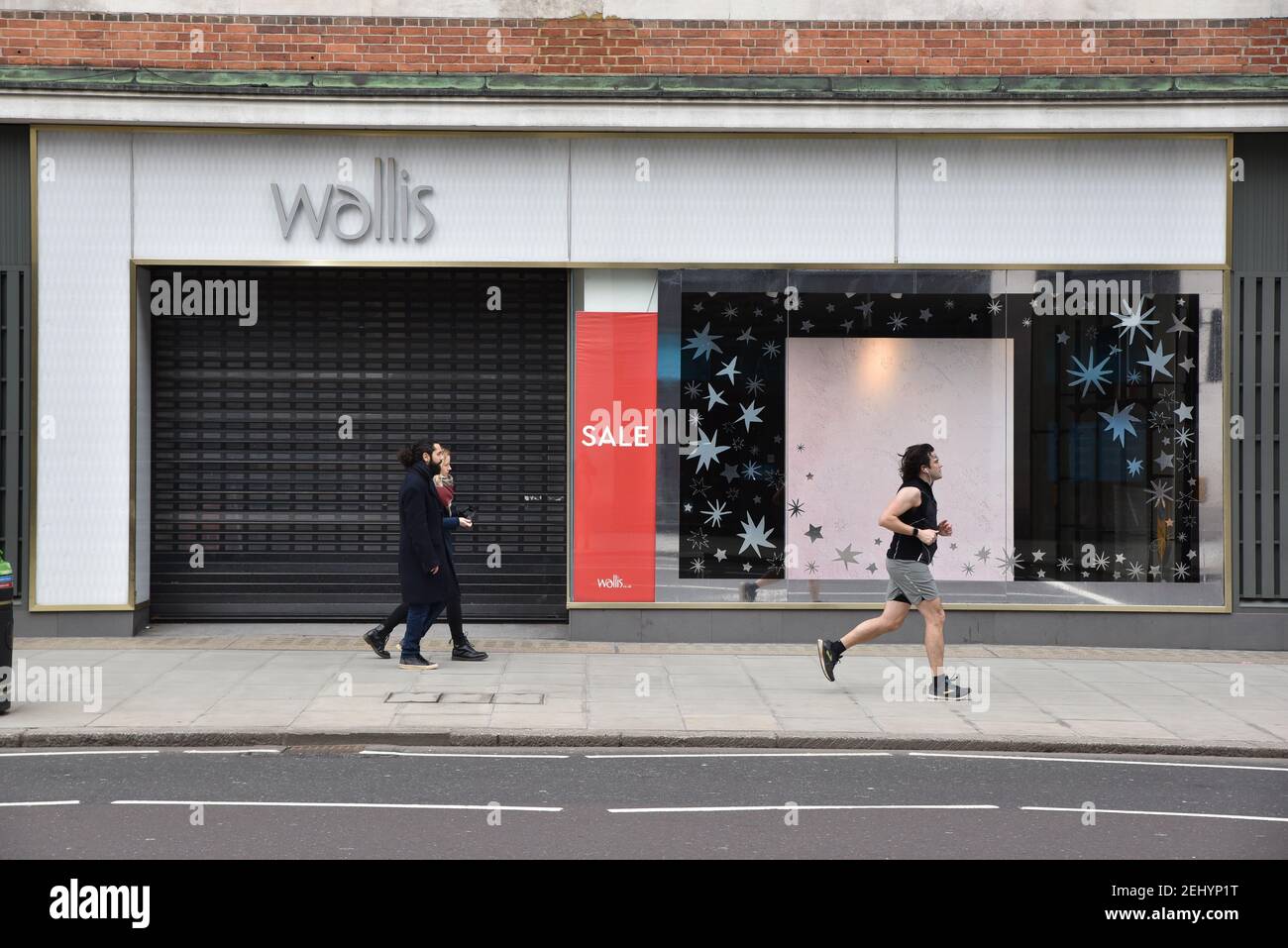 Oxford Street, London, UK. 20th Feb 2021. People in London on a warm Saturday in lockdown with all none essential shops still closed. Credit: Matthew Chattle/Alamy Live News Stock Photo