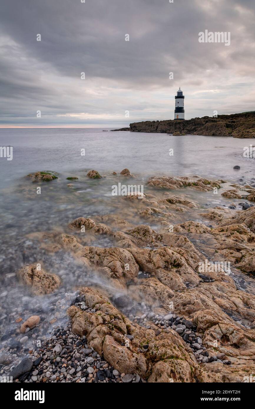 Penmon Point lighthouse at dawn, Anglesey, North Wales Stock Photo