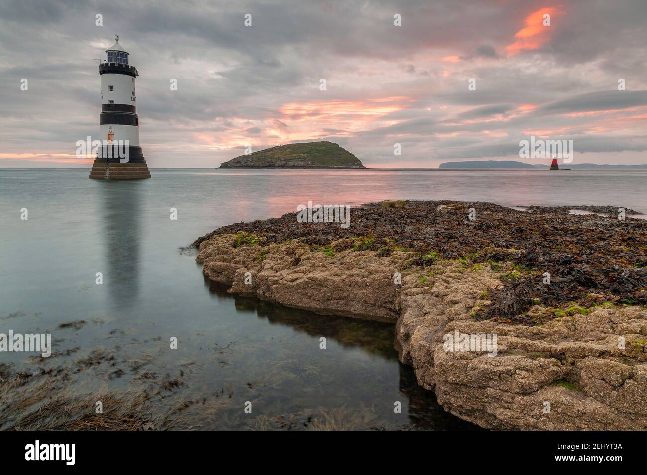 Penmon Point lighthouse at dawn, Anglesey, North Wales Stock Photo