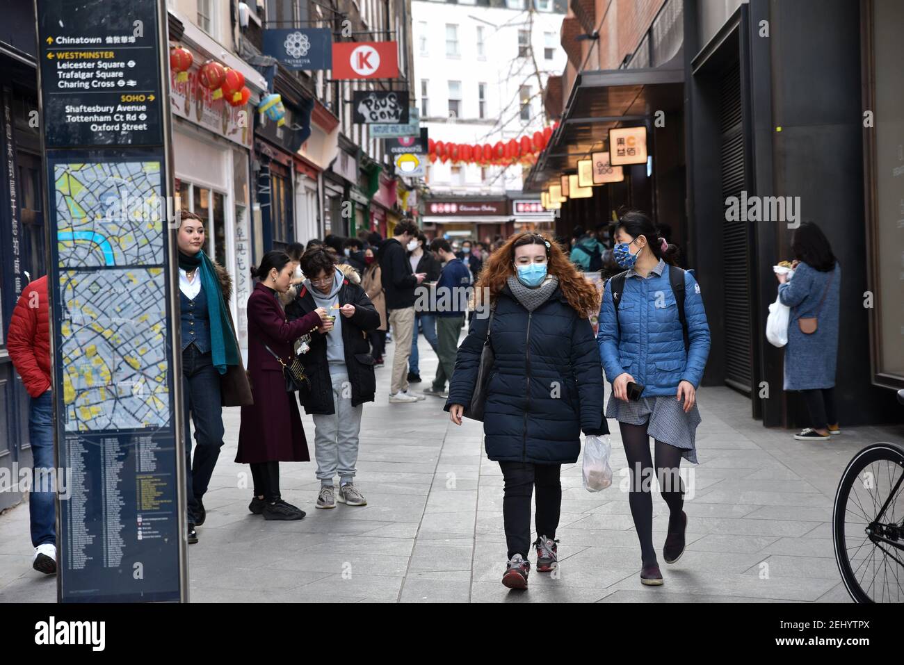 Soho, London, UK. 20th Feb 2021. People in Soho on a warm Saturday in lockdown with all none essential shops still closed. Credit: Matthew Chattle/Alamy Live News Stock Photo