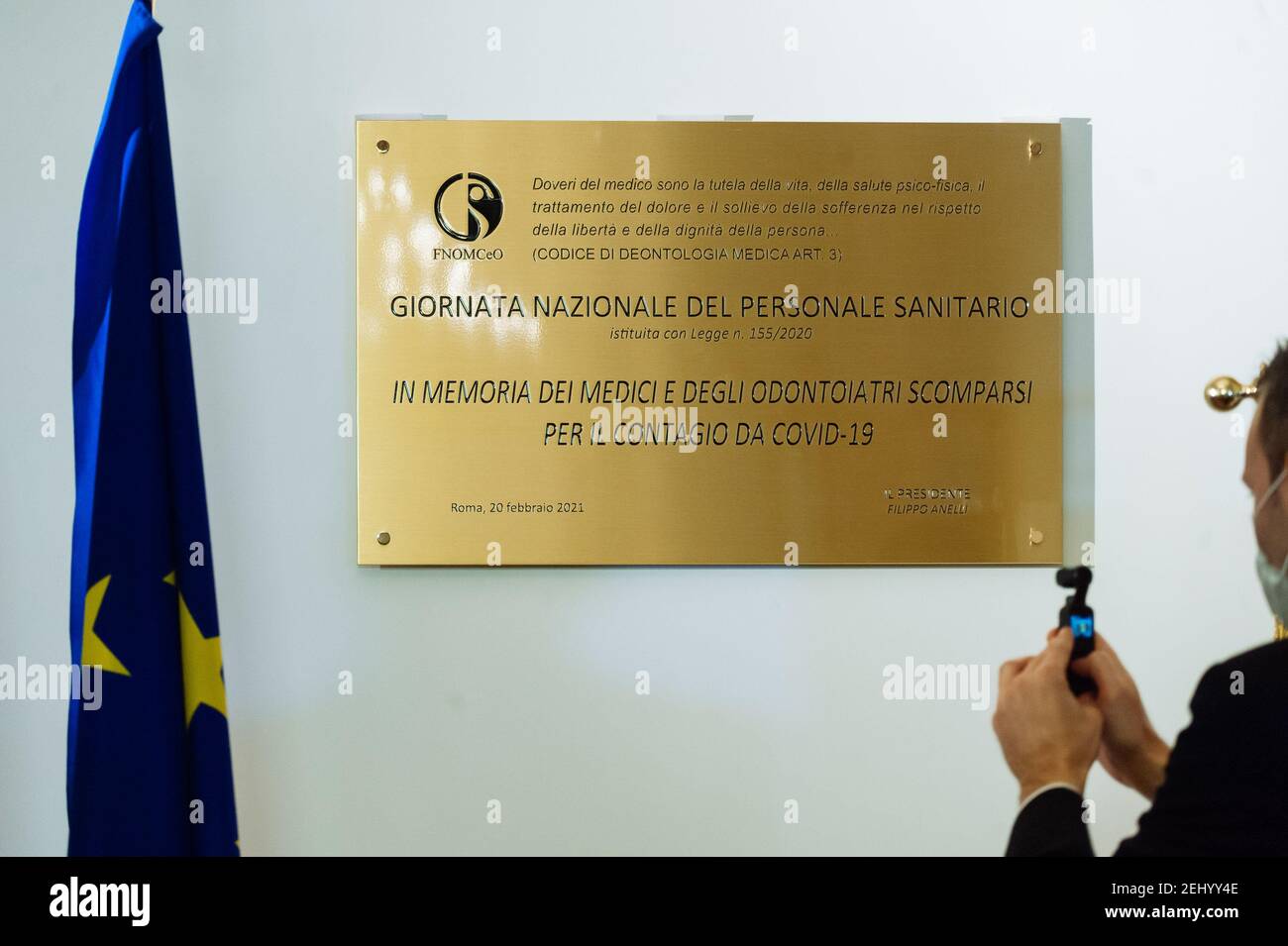 A commemorative Placard is being placed at the FNOMCeO's headquarter in Rome.The National Federation of the Orders of Doctors and Dental Surgeons (FNOMCeO) celebrated the National Day of Healthcare Workers, Healthcare Members, Assistance Workers and Volunteers in Rome. The celebration is dedicated to the memory of doctors and dentists who died due to Covid-19 and it was going live at the Civic Hospital in Codogno and Berlin. Several authorities and celebrities like Maria Elisabetta Alberti Casellati, Italian Senate President; Roberto Fico, President of the Italian Chamber of Deputies and Rober Stock Photo