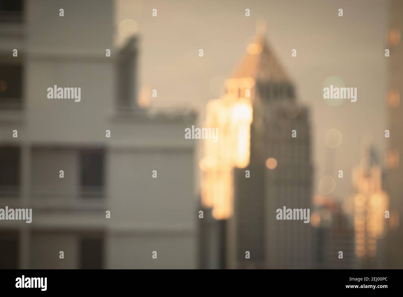 Abstract blur city estate building in morning view background. Cityscape skyline from top office window view. Blurred shine bokeh real architecture mo Stock Photo