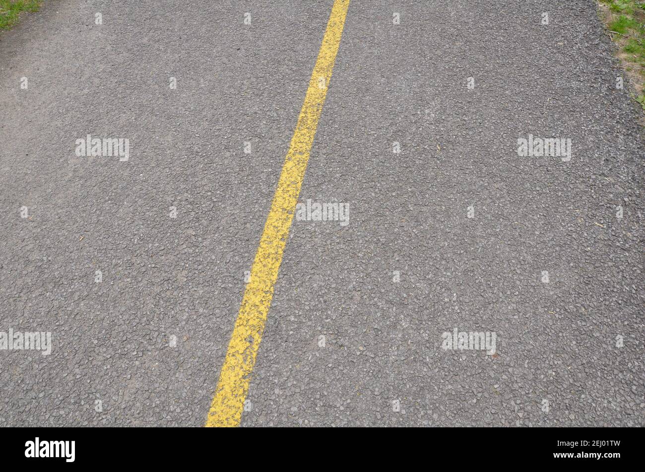 yellow paint line on black asphalt ground or pavement Stock Photo Alamy