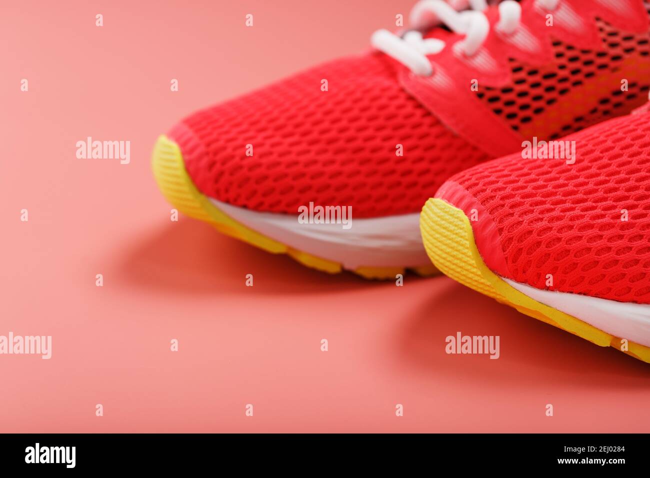 Sports pink sneakers on a pink background with free space. Top view ...