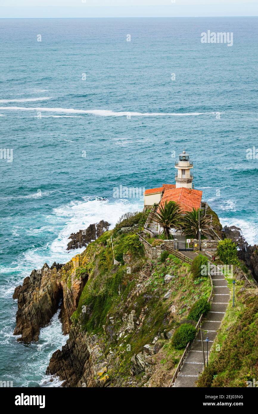 Cudillero lighthouse in on the Coast of Asturias, Spain. Picturesque seascape with an old building. Stock Photo