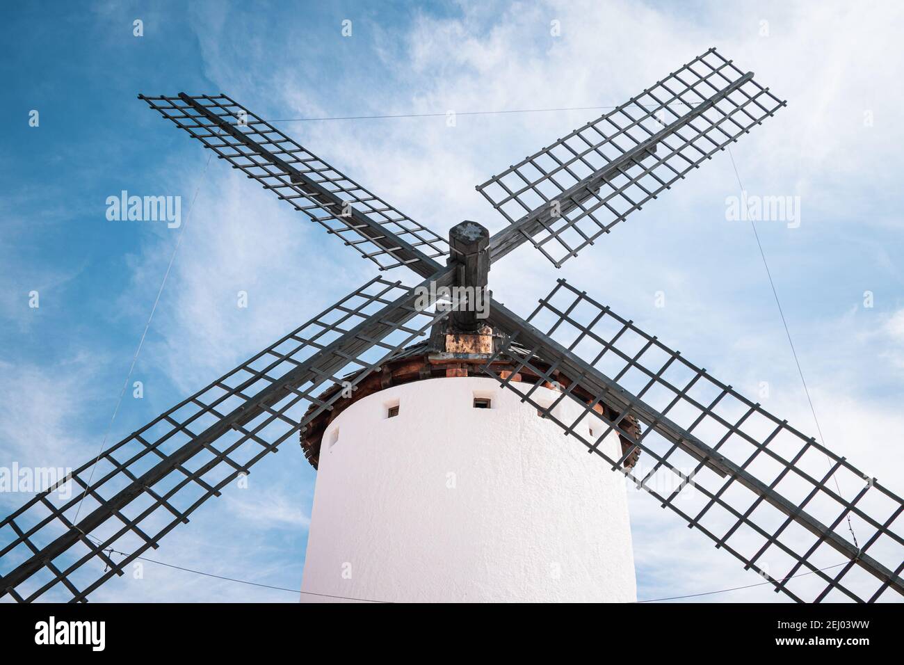 Detail of old white windmill against a blue sky in Campo de Criptana, Castile la Mancha, Spain. Stock Photo