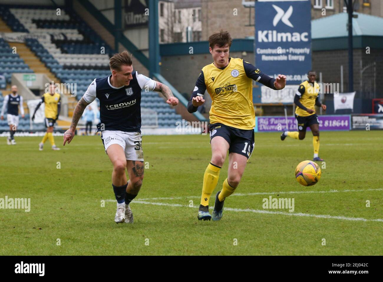 Dens Park, Dundee, UK. 20th Feb, 2021. Scottish Championship Football, Dundee FC versus Queen of the South; Jason Cummings of Dundee and Calvin McGrory of Queen of the South Credit: Action Plus Sports/Alamy Live News Stock Photo