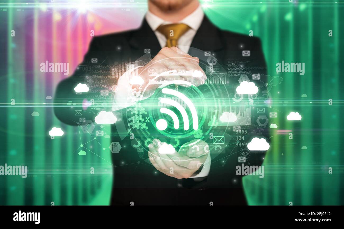 Businessman holding signal icon in his hands with multiple technology ...