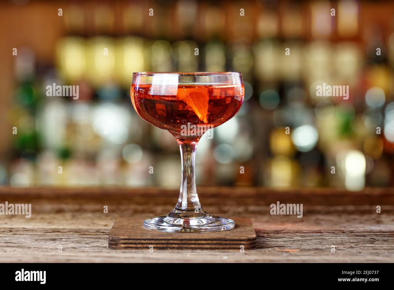 A cocktail with orange based on rum. Drinks El President, photo for the