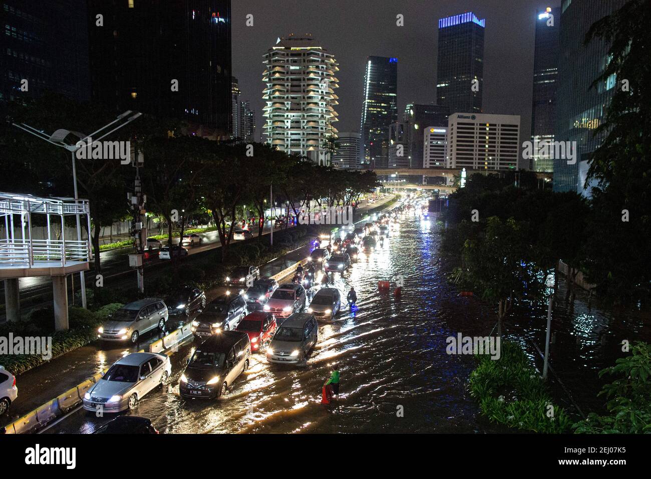 Jakarta, Jakarta, Indonesia. 20th Feb, 2021. A view of traffic jam during a flood following heavy rains at business district in Jakarta, Indonesia on February 20, 2021. At least 21 areas in the Indonesian capital were hit by floods Saturday following heavy rains, during which thousands of homes were also damaged, according to the National Board for Disaster Management Credit: Afriadi Hikmal/ZUMA Wire/Alamy Live News Stock Photo