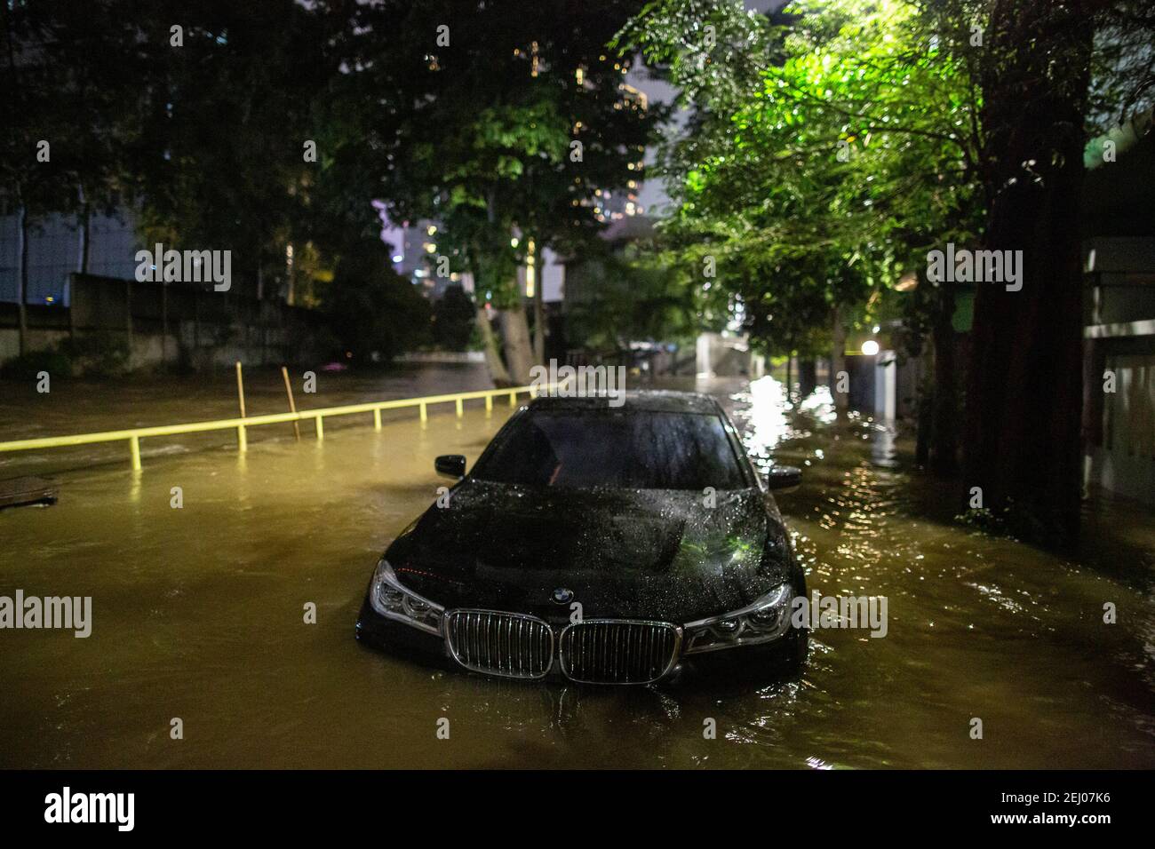 Jakarta, Jakarta, Indonesia. 20th Feb, 2021. A view of inundated car during a flood following heavy rains at business district in Jakarta, Indonesia on February 20, 2021. At least 21 areas in the Indonesian capital were hit by floods Saturday following heavy rains, during which thousands of homes were also damaged, according to the National Board for Disaster Management Credit: Afriadi Hikmal/ZUMA Wire/Alamy Live News Stock Photo