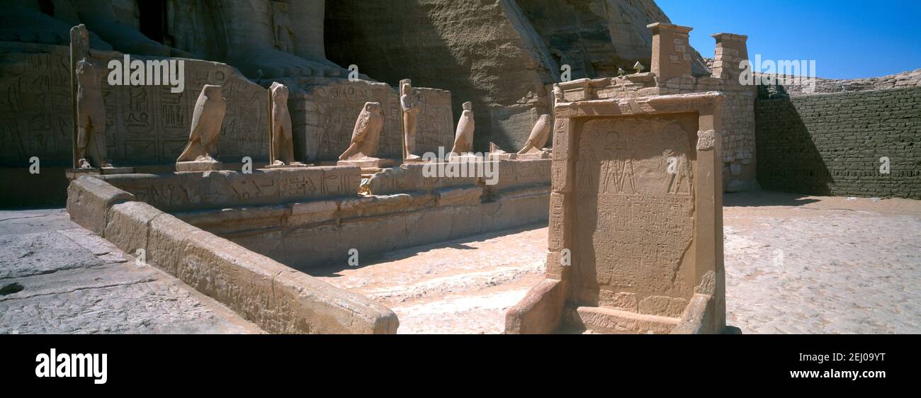 Temple of Ramesses II Abu Simbel Egypt Statues of Rameses II wife Nefertari and children by his Feet Stock Photo