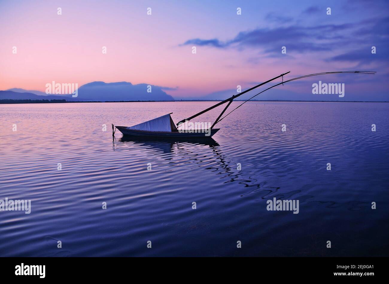 Landscape with a typical 'gaita', a Greek fishing boat on the waters of Missolonghi Lagoon in Aetolia-Acarnania, Greece. Stock Photo