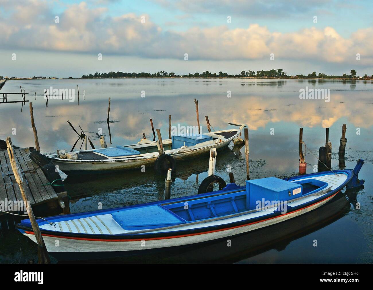 Landscape with traditional Greek fishing boats on the waters of Missolonghi Lagoon in Aetolia-Acarnania, Greece. Stock Photo