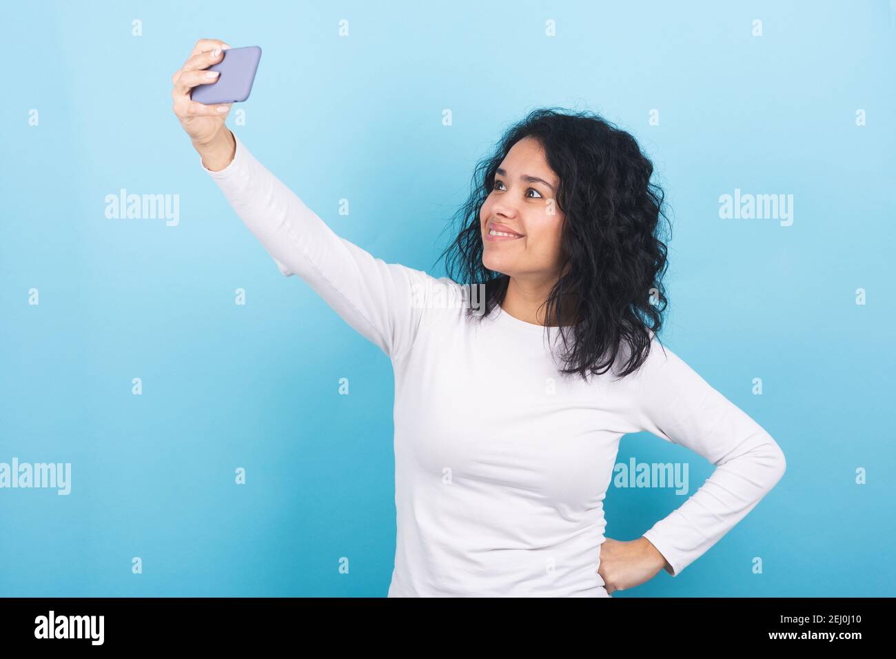 brunette girl takes a selfie with her cell phone Stock Photo - Alamy