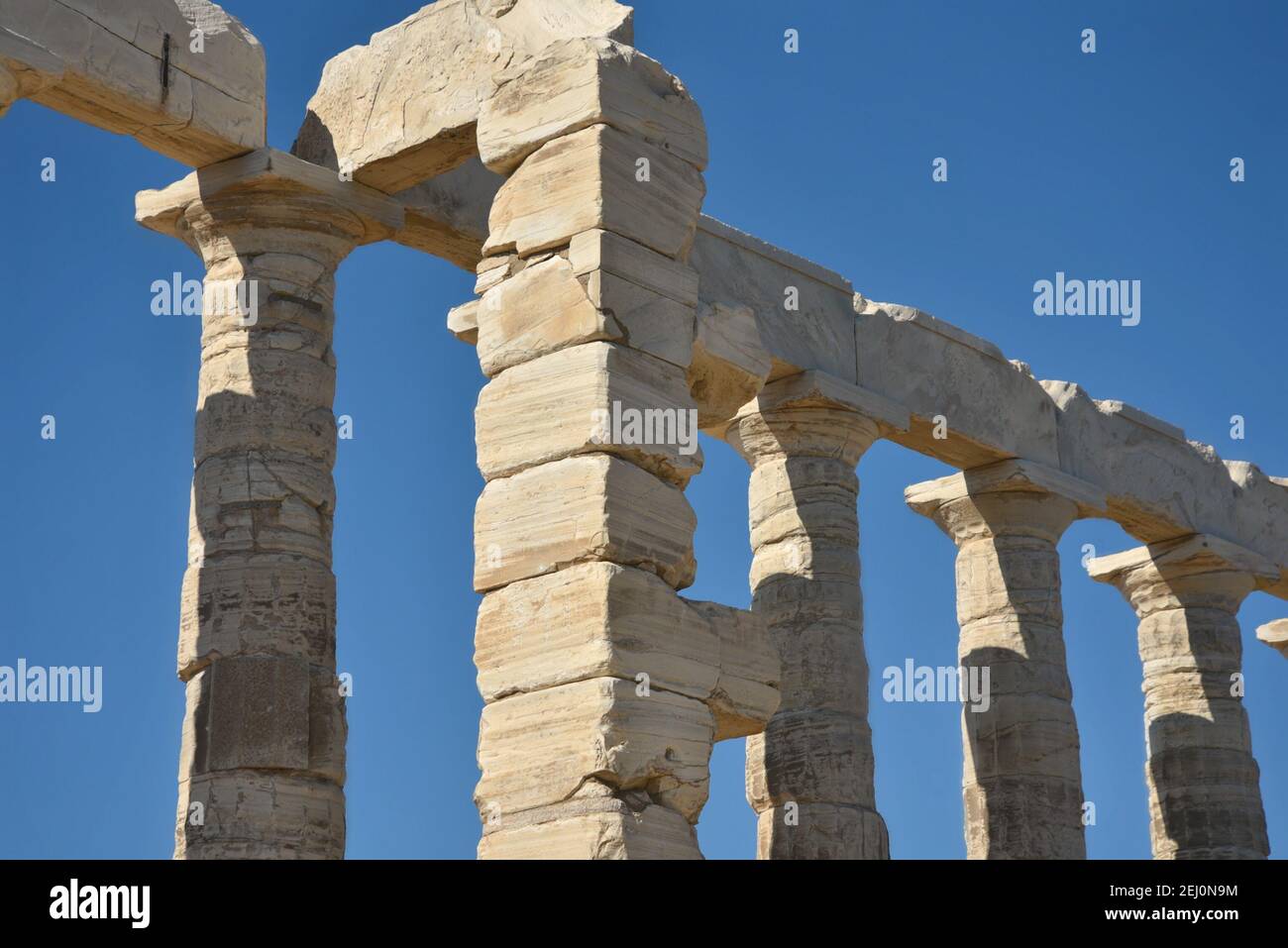 Marble columns view of the ancient Greek Doric style Temple of Poseidon ...