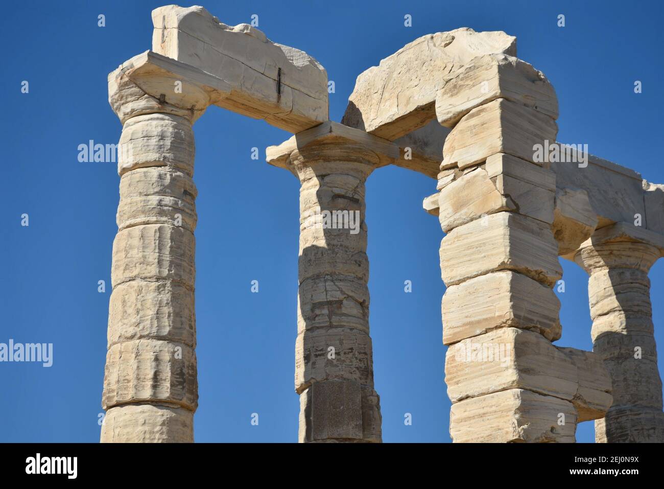 Marble columns view of the ancient Greek Doric style Temple of Poseidon ...