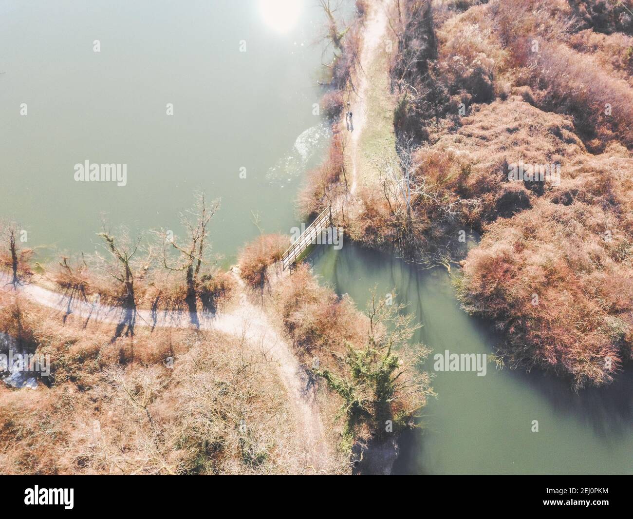Aerial view of Savica fishing pond, located near eastern heating plant in Zagreb city, above secluded wooden bridge crossing water Stock Photo