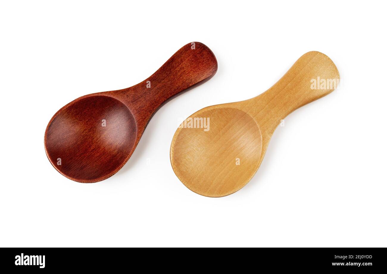 Pair of small wooden spoons for tea or shugar isolated on white background. Dark and light empty spoons for food design. Eco-friendly tableware. Stock Photo