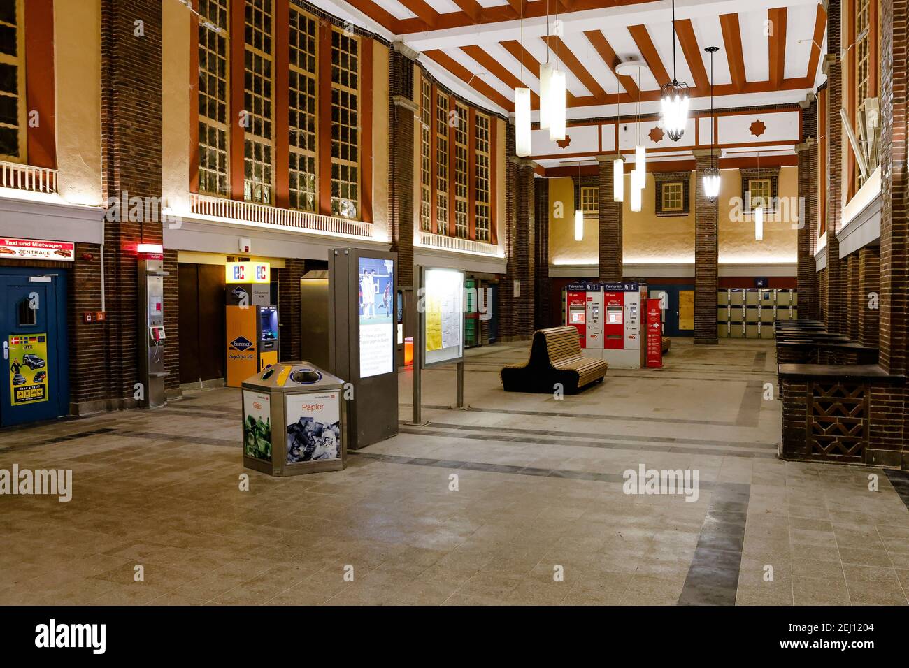 Flensburg, Germany. 20th Feb, 2021. The entrance hall in the train station is deserted. On Saturday evening, February 20, a nightly curfew from 9 p.m. to 5 a.m. came into effect in Flensburg. Previously possible meetings between a household and another person are not allowed. Credit: Frank Molter/dpa/Alamy Live News Stock Photo