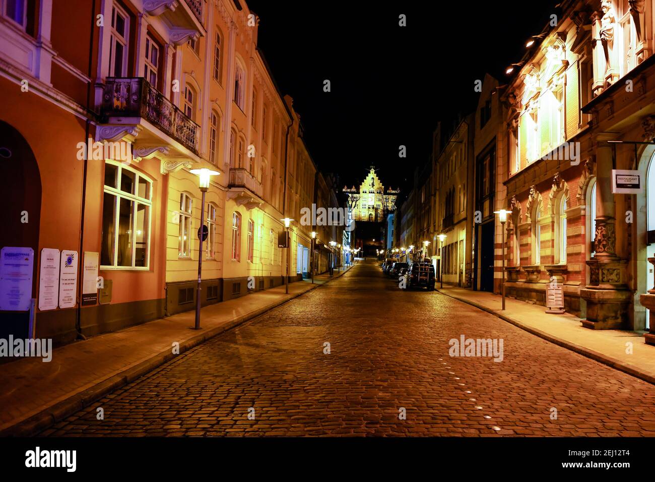Flensburg, Germany. 20th Feb, 2021. A street in the city centre is deserted. On Saturday evening, February 20, a nighttime curfew from 9 p.m. to 5 a.m. went into effect in Flensburg. Previously possible meetings between a household and another person are not allowed. Credit: Frank Molter/dpa/Alamy Live News Stock Photo