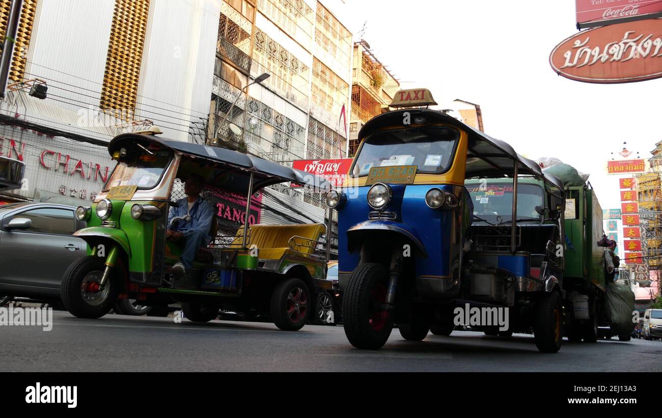Fastest Rickshaw BANGKOK, THAILAND - 18 MARCH, 2019: Tuk tuks on street of Asian city ...