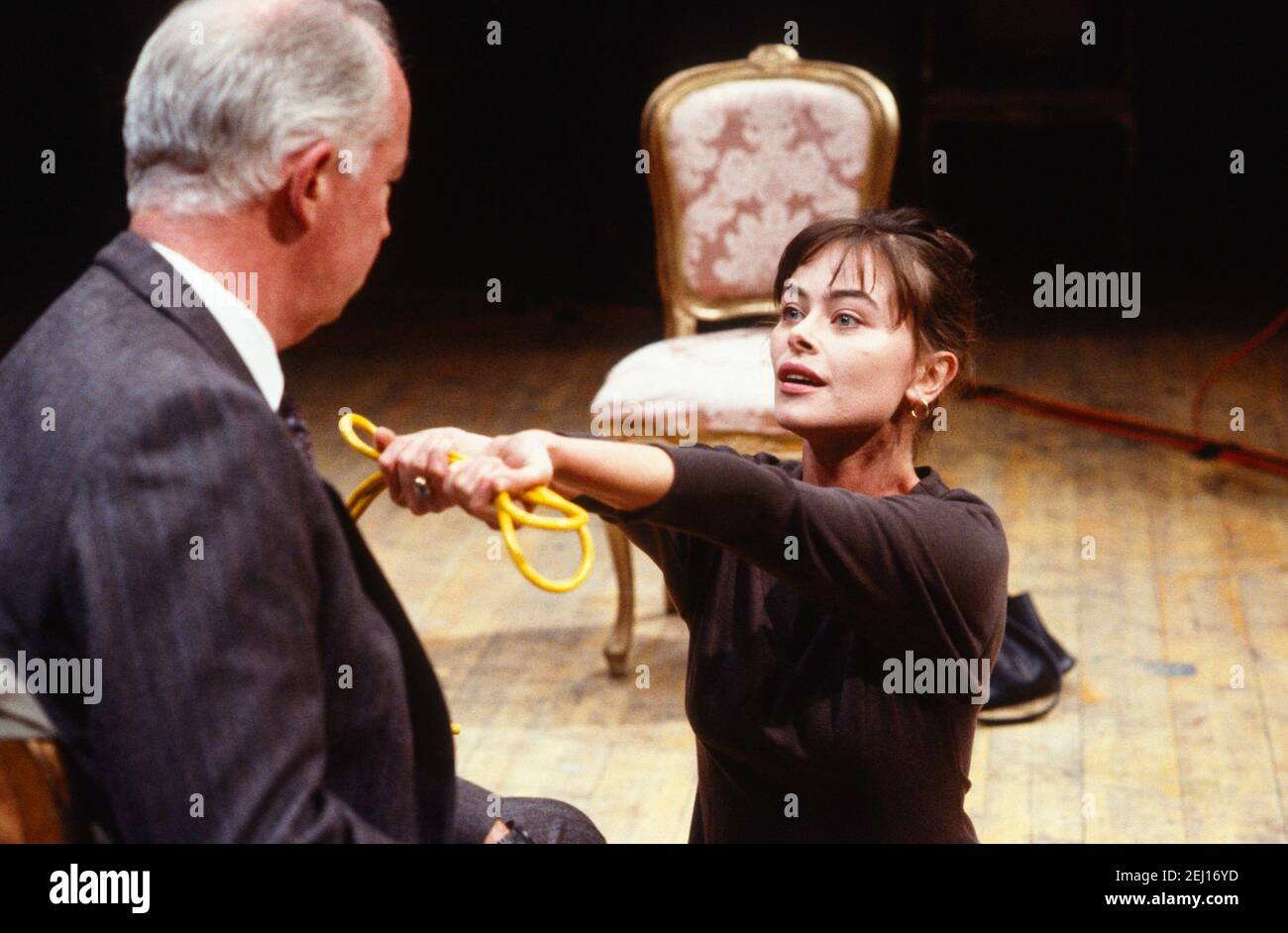 David Calder (Larry Palmer), Polly Walker (Charity Luber) in H.I.D. (Hess is Dead) by Howard Brenton at the Almeida Theatre, London N1  28/09/1989  a Royal Shakespeare Company (RSC) production  design: Eryl Ellis & Kenny MacLellan  lighting: Geraint Pughe  director: Danny Boyle Stock Photo