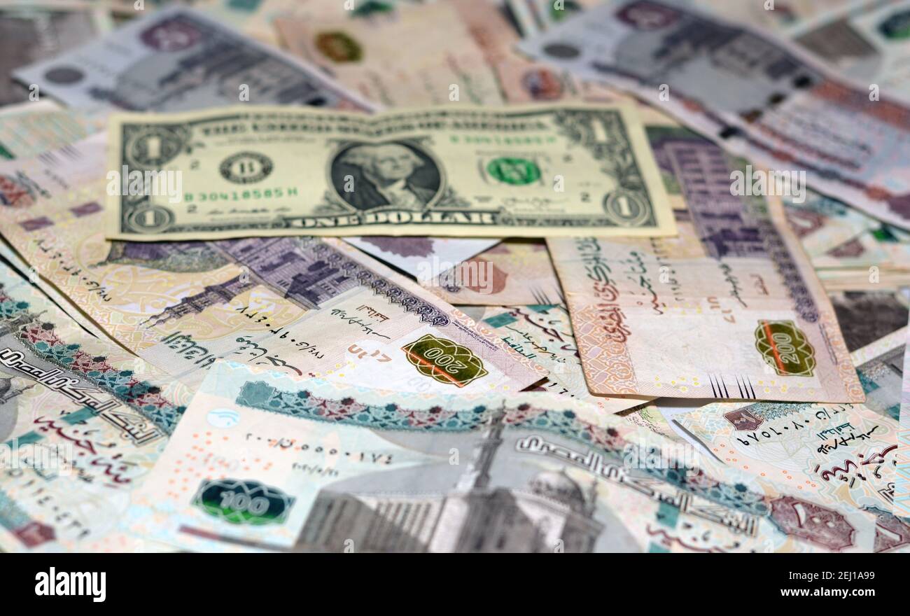 egypt-national-currency-with-usa-dollar-banknote-backdrop-egyptian-pounds-money-and-american-dollars-exchange-rate-2EJ1A99.jpg