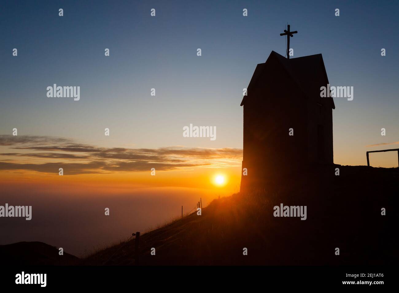 Dawn at the little church, mount Grappa landscape, Italy. Italian alps panorama Stock Photo