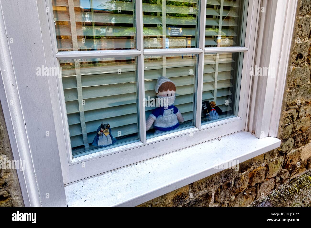 Childrens  toy Nurse dolls in the window of a house in Warminster, England, in praise of the NHS during the Covid 19 global pandemic Stock Photo