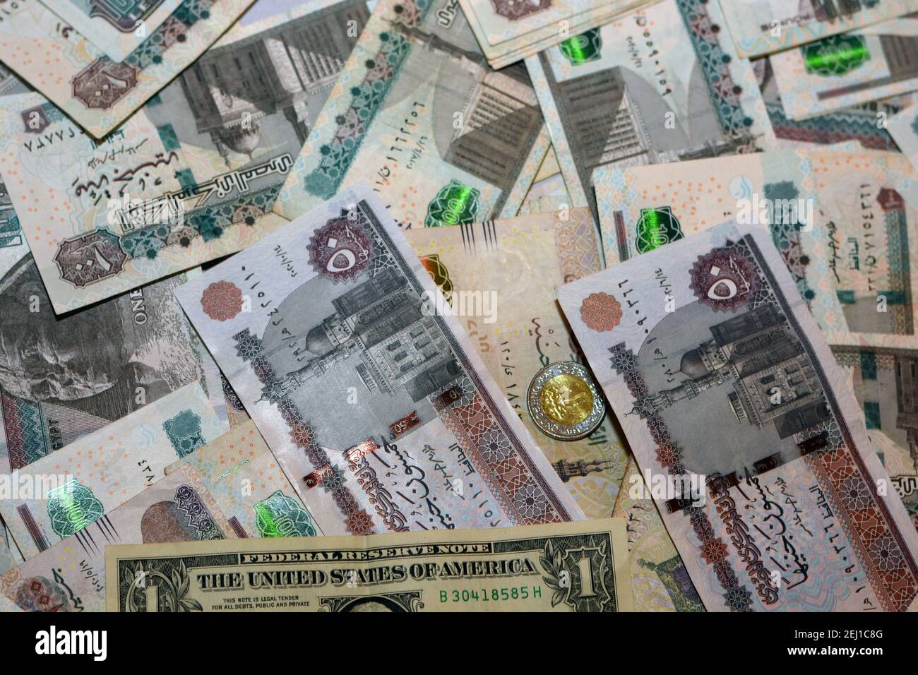 egypt-national-currency-with-usa-dollar-banknote-backdrop-egyptian-pounds-money-and-american-dollars-exchange-rate-2EJ1C8G.jpg