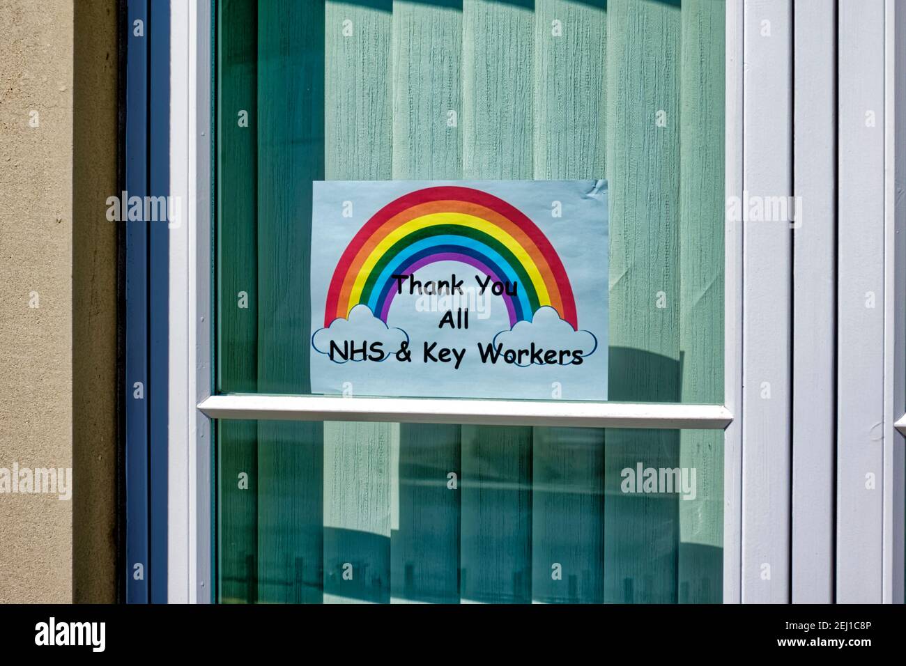Warminster, Wiltshire  UK - April 22 2020: A Thank You NHS  All Key Workers Rainbow of Hope Sign in a window Stock Photo