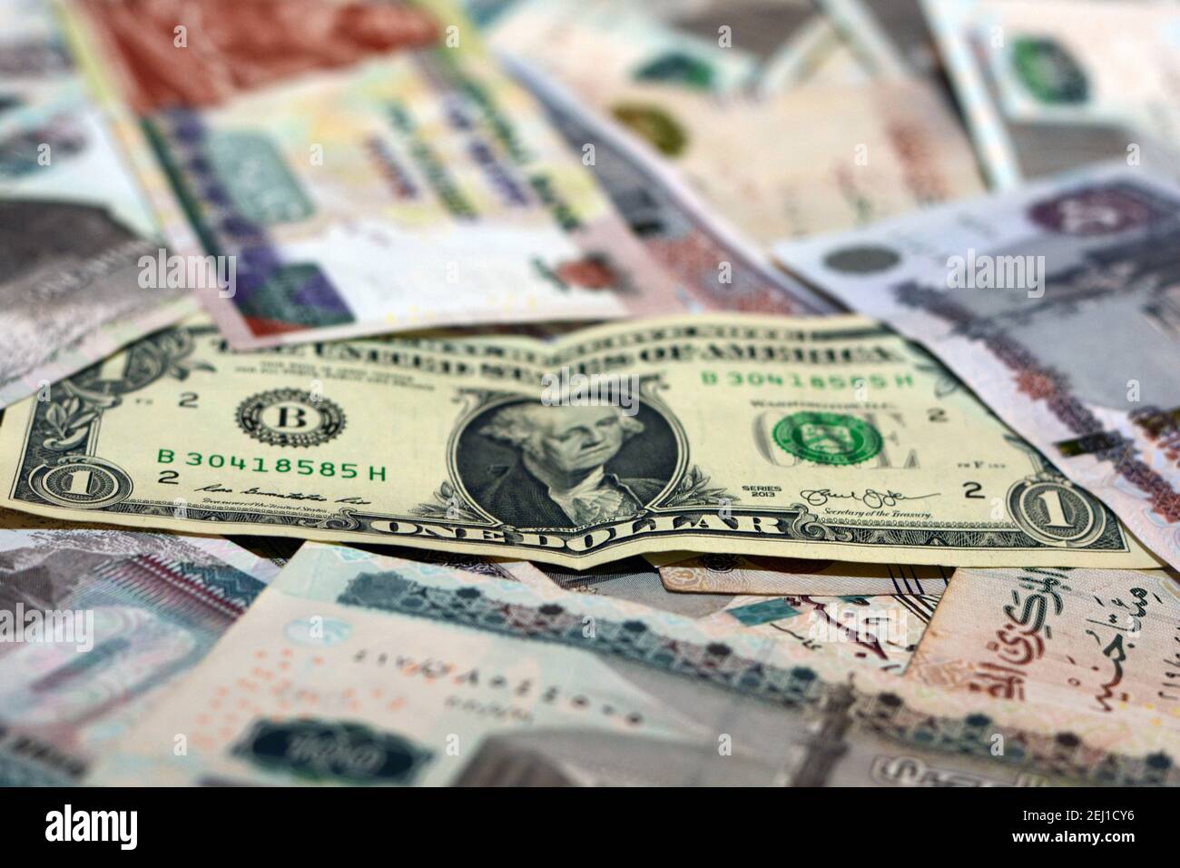 Egypt national currency with USA dollar banknote backdrop. Egyptian pounds money and American dollars exchange rate Stock Photo