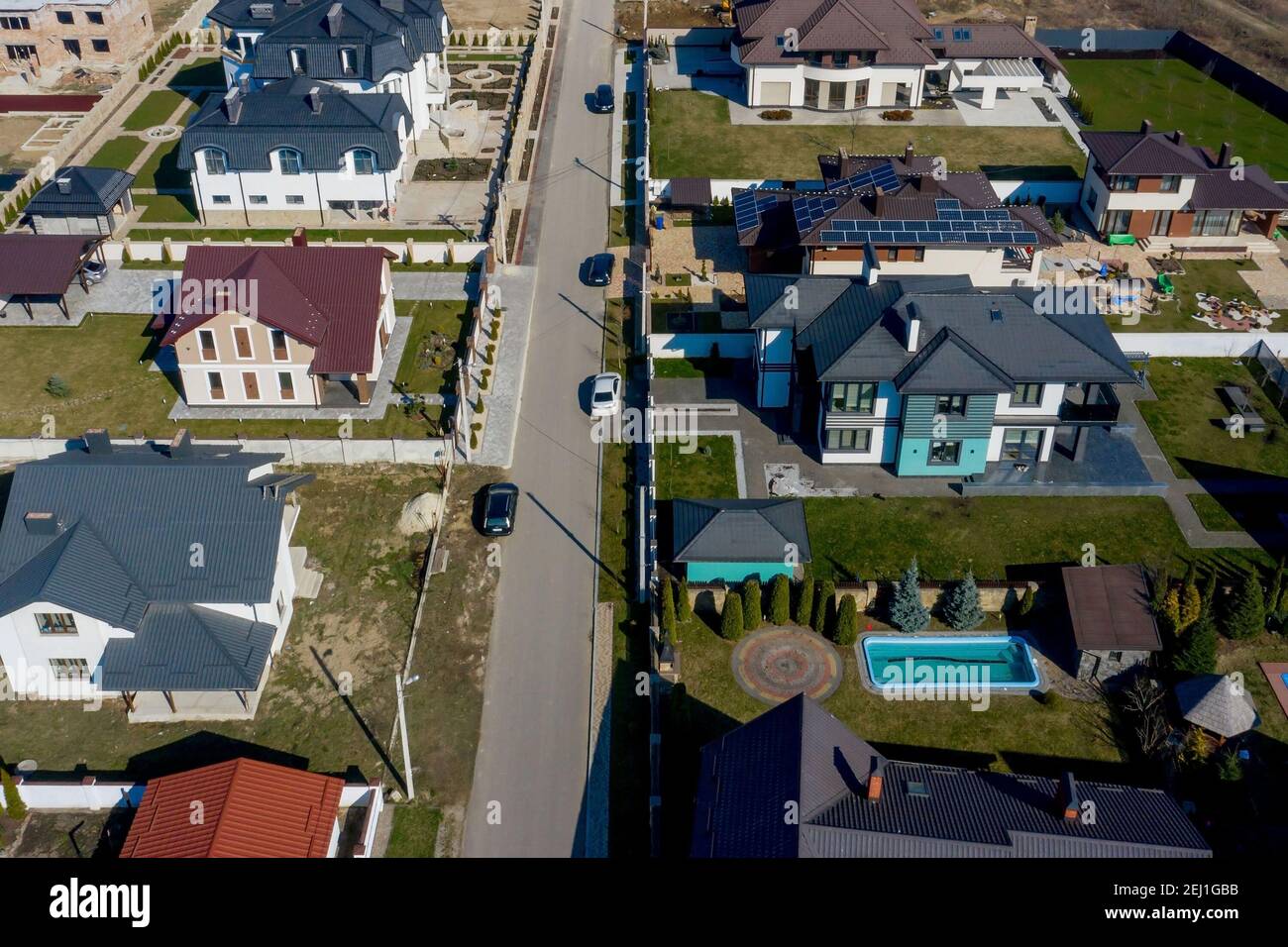 aerial view of houses on Ukraine housing estates, some with building on ...