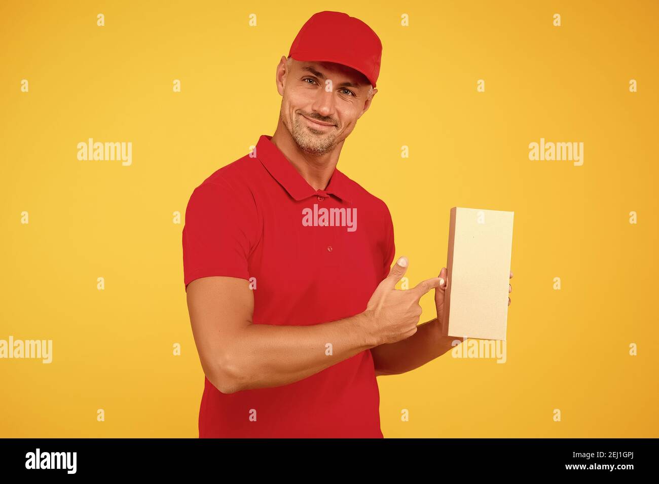 Your parcel our passion. Courier guy point finger at parcel box ...
