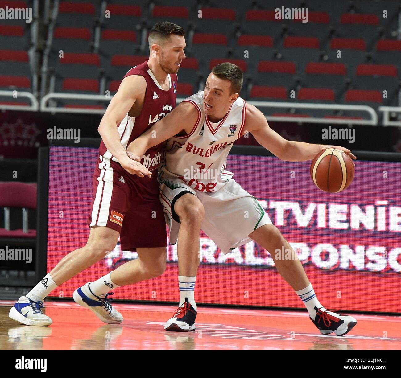 Riga, Latvia. 20th Feb, 2021. Dairis Bertans (L) of Latvia defends Dimitar Atanasov Dimitrov of Bulgaria during their FIBA EuroBasket 2022 qualifying basketball match in Riga, Latvia, Feb