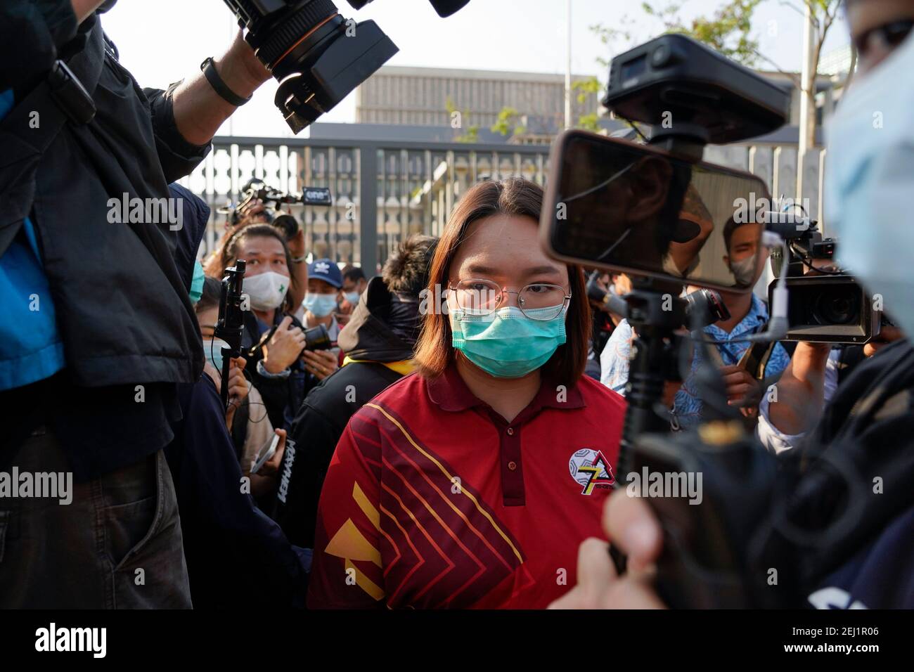 Thai pro-democracy leader Panusaya Sithijirawattanakul seen leaving the parliament building after negotiating with the police about how long the protest will take.Pro-democracy protesters demonstrate demanding the prime minister to resign, reforms the monarchy and release every prisoner under article 112 or lesse majeste law outside the Thai parliament building in Bangkok. Stock Photo