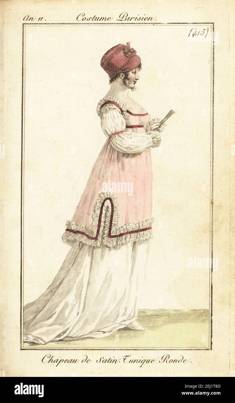 Woman with fan in satin hat, short tunic edged with ribbon and frills, Paris, 1802. Chapeau de Satin. Tunique Ronde. Handcoloured copperplate engraving from his Pierre de la Mesangere’s Journal des Dames et des Modes, Magazine of Women and Fashion, Paris, An 11, 1802. Illustrations by Carle Vernet, Jean-Francois Bosio, Dominique Bosio and Philibert Louis Debucourt, engraved by Pierre-Charles Baquoy. Stock Photo