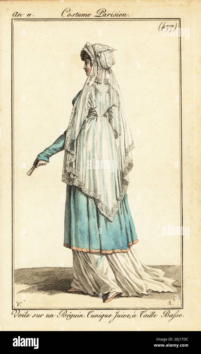 Woman in formal costume with long veil on a wimple, calf-length tunic over a long white dress. She holds a fan. Voile sur un Béguin. Tunique Juive à Taille Basse. Handcoloured copperplate engraving by Pierre-Charles Baquoy after Carle Vernet from Pierre de la Mesangere’s Journal des Dames et des Modes, Magazine of Women and Fashion, Paris, An 11, 1803. Stock Photo